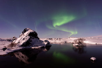 Aurora Borealis Outcrop with Reflection on Water